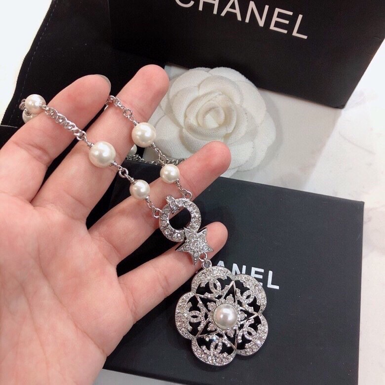 Ch*el brooches
